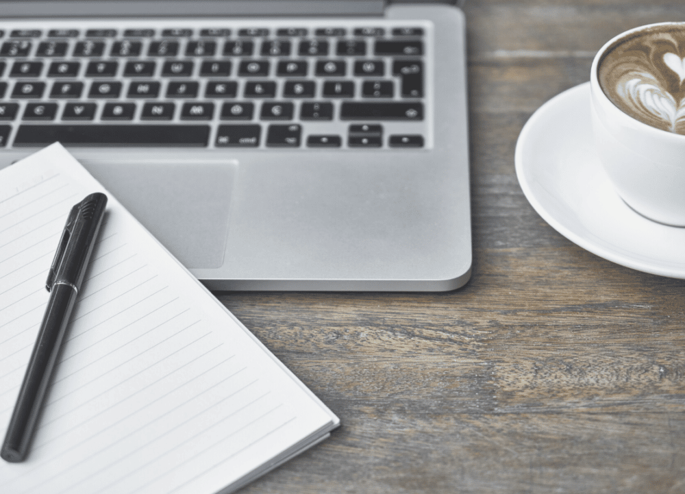 5 online courses every Executive Assistant should take. Desk with laptop and coffee